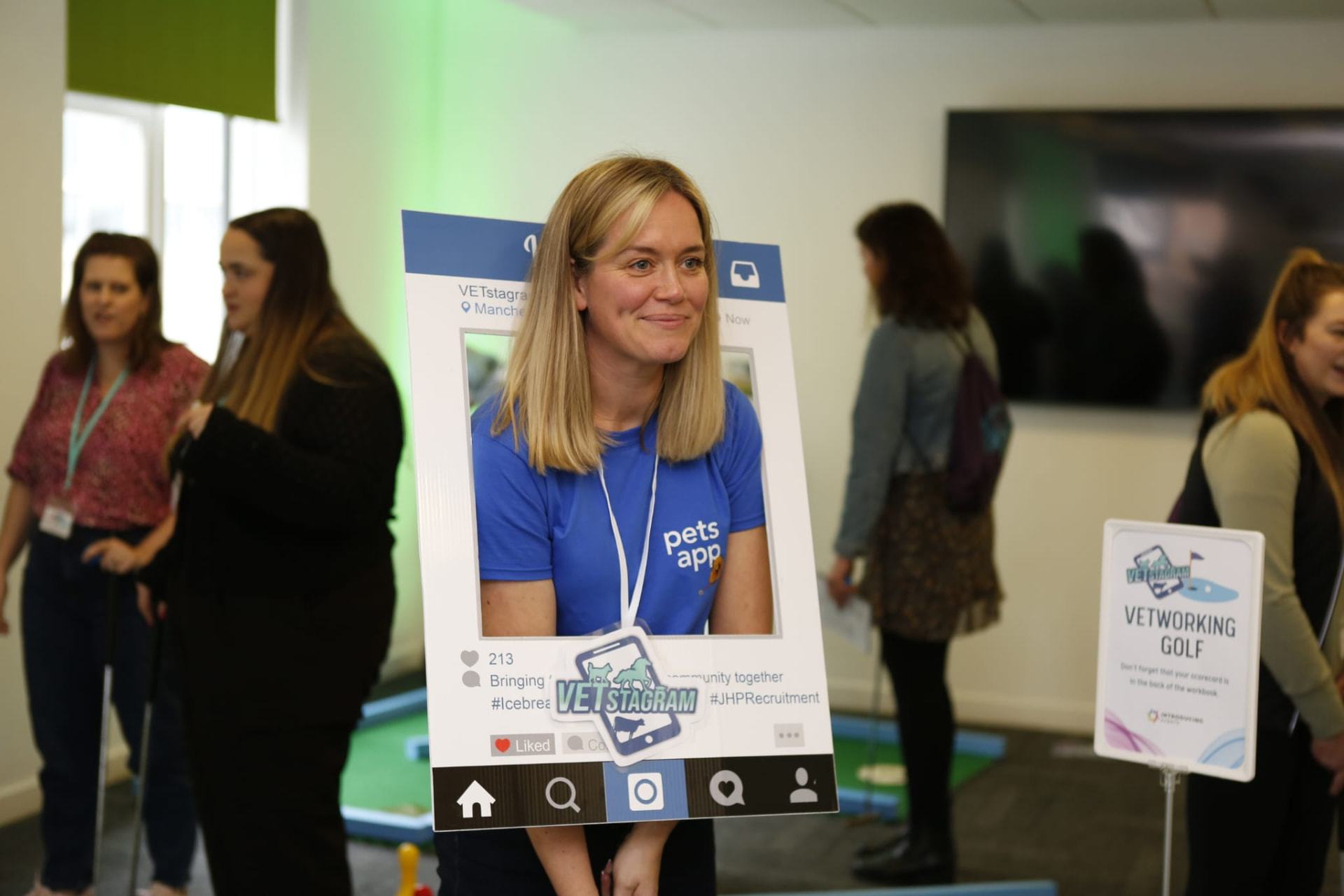 A delegate holding a giant Instagram-style photo frame at VETstagram